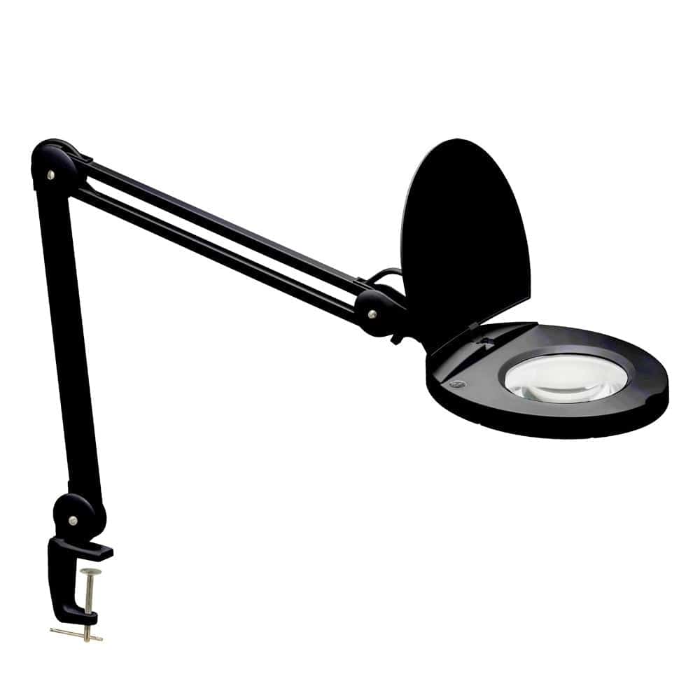 The design of the Magnifier Lamp family is both highly practical and intriguing to the eye. The design features an integrated LED light. LED fixtures produce light at up to 90 percent better efficiency than incandescent lighting. The metal frame is installed on a table, desk or shelf, with an articulated arm that can be adjusted to the desired angle. A dimmable LED and magnifying function make it the perfect addition to your favorite reading or work corner. With its elegant design, it adds a note of functional luxury to your bedroom or office space, or wherever stylish directional light is needed.