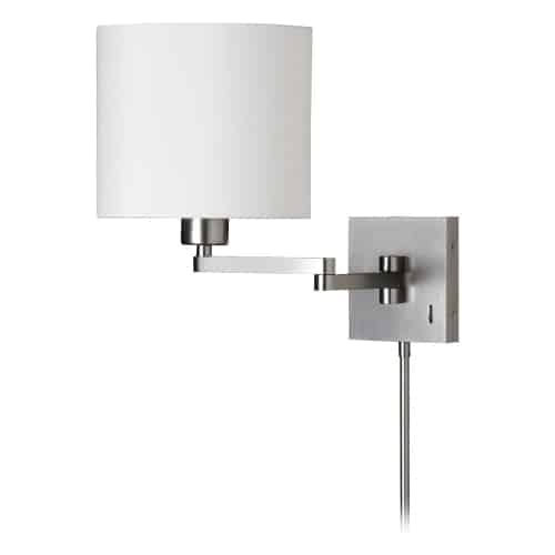 A classic look gets a conveniently modern makeover in the Arm Swing Lamp collection. It's a versatile design with a classic profile, and adjustable placement you can customize. The metal frame comes in a subtle satin chrome finish, contrasting a white fabric shade in your choice of drum or tapered drum shape. It's the perfect way to add spot lighting in areas where floor space is at a premium. With its nod to traditional forms, its sleek modern silhouette adds an element of luxury and style to living rooms, hallways or office suites.